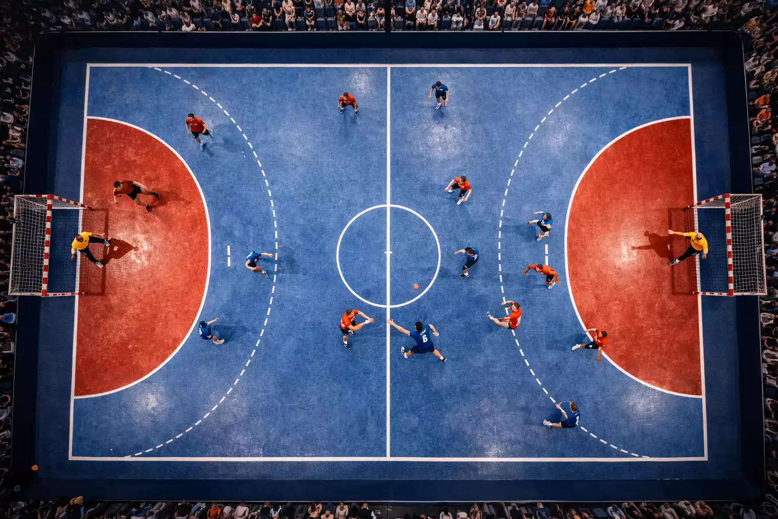 Handballspiel aus der Vogelperspektive mit beiden Mannschaften